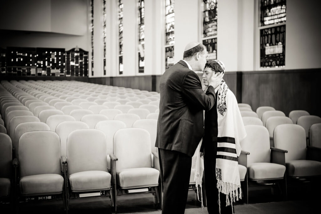 Toronto Bar Mitzvah Photography | Father and Son Father sharing a quiet moment with his son before a Toronto bar mitzvah ceremony