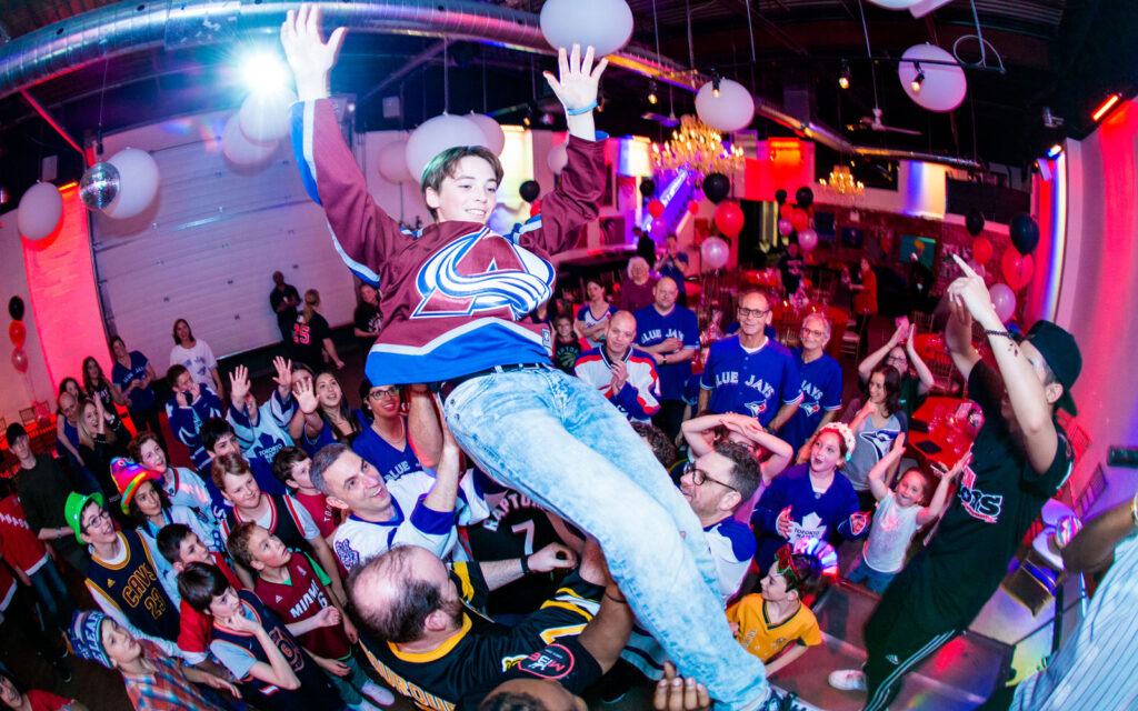 toronto-bar-mitzvah-fun-bparty-photo Bar mitzvah boy flying above the crowd during an energetic Toronto party